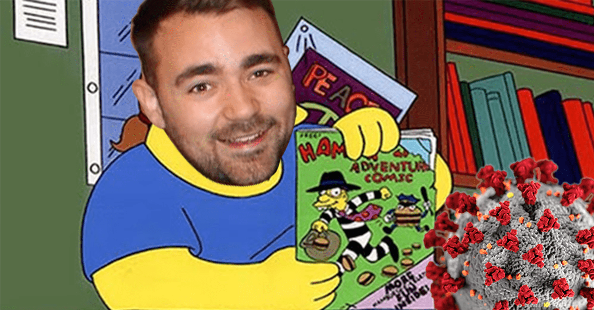 picture of a man holding a simpsons magazine